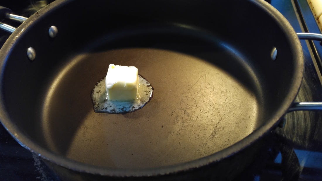 butter melting in frying pan