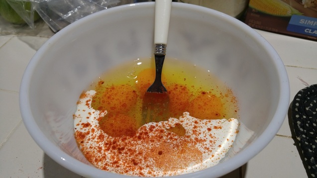 adding paprika to eggs and cream